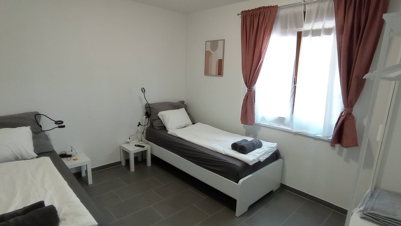 Lounge Michlfarm Schlafzimmer, © michlfarm Doppelzimmer mit zwei getrennten Betten