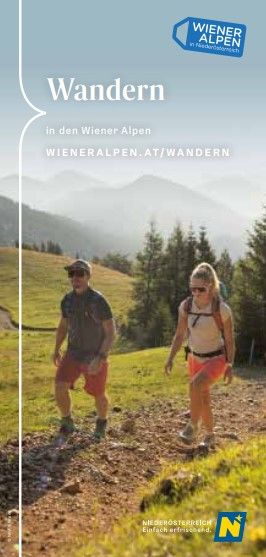 Coverbild: 2 Wanderende mit Bergpanorama im Hintergrund. 