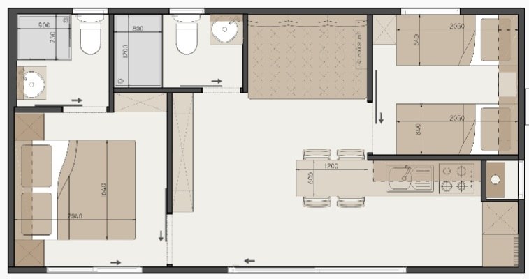 Grundriss eines Chalets mit Schlafzimmer, Badezimmer, K&uuml;che und Wohnbereich.