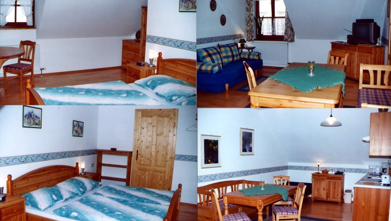 Innenansicht einer gem&uuml;tlichen Ferienwohnung mit Holzm&ouml;beln, Bett, Sofa und Esstisch.